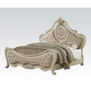 The Ragenardus collection harmonizes traditional details with functional design to accommodate today-'s styles. This bedroom collection features vintage white veneers, curved panel HB, button tufted headboard/footboard, crown & raised scrolled work orname
