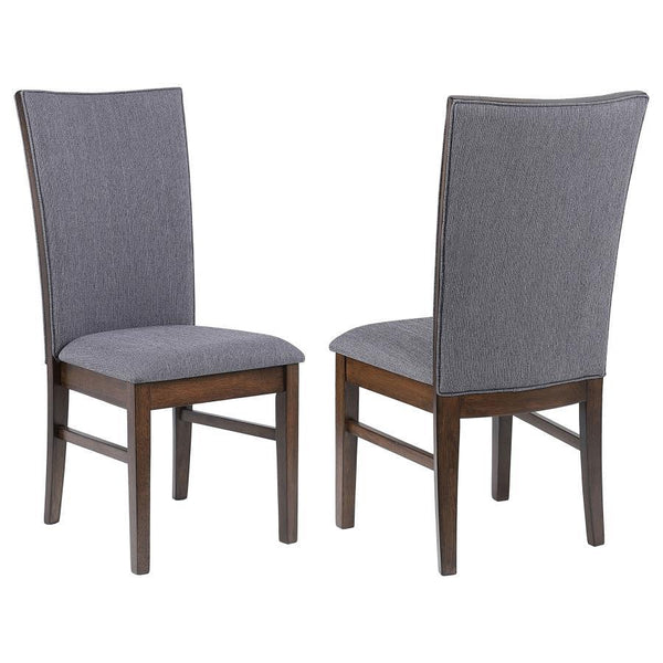 This elegant dining side chair combines comfort and sophistication, making it the perfect complement to any dining table. Upholstered in soft gray fabric on both sides of the backrest and the seat, it offers a cohesive and refined look. The sturdy frame i