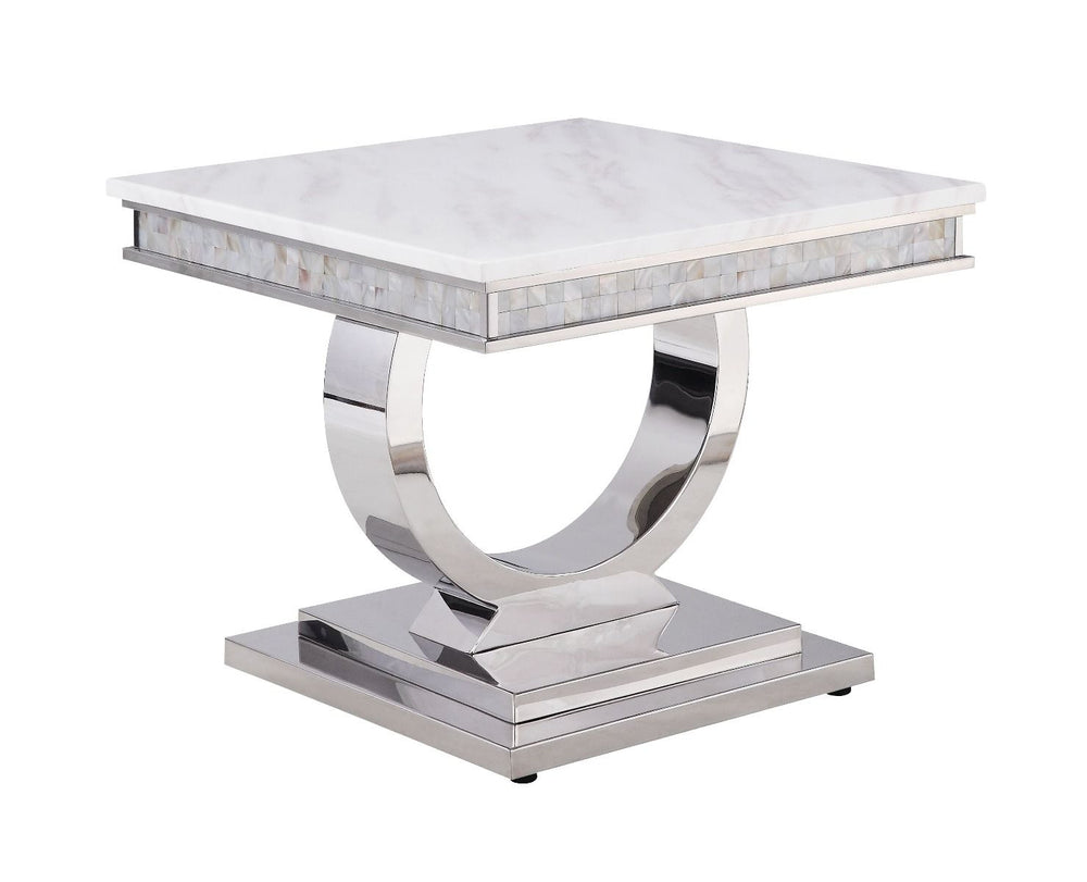 This beautiful contemporary work places a strong emphasis on lustrous materials that make a bold statement of personality and style. Shiny metal frame and white marble top complement each other perfectly, making the table more visually appealing. The Zand