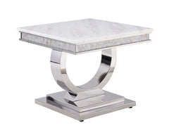 This beautiful contemporary work places a strong emphasis on lustrous materials that make a bold statement of personality and style. Shiny metal frame and white marble top complement each other perfectly, making the table more visually appealing. The Zand