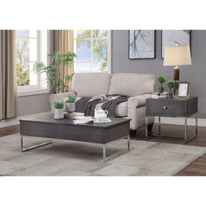 Maximize your living space with the attractive Iban Coffee Table. Designed for with both function and style, this rectangular occasional table features a rich gray oak finish and a sturdy, metal sled base. The minimalist style and neutral color scheme cre