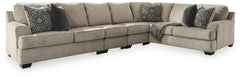 Whether your vision is clean and contemporary or cozy modern farmhouse, this sectional in a stone-tone neutral upholstery has the corner on style. Merging ultimate comfort with striking good looks, this chic sectional includes coordinating accent pillows 