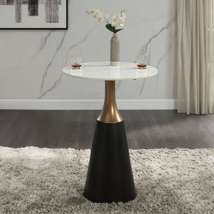 The Jaramillo collection boasts a sophisticated round counter height table with a sleek marble top and a fixed table top design. Supported by a striking single pedestal base in a stylish black finish, this table is the epitome of modern elegance. Paired w
