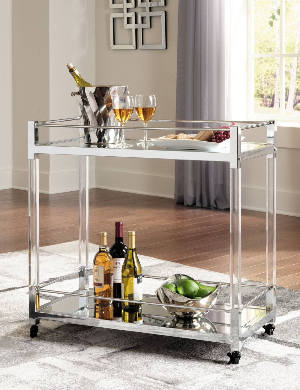 Reflect your love for contemporary style with this bar cart. With two shelves made with mirrored glass, it adds both light and a touch of glam to your space. A clear acrylic and chrome-tone frame is a modern take on understated elegance. And thanks to rol