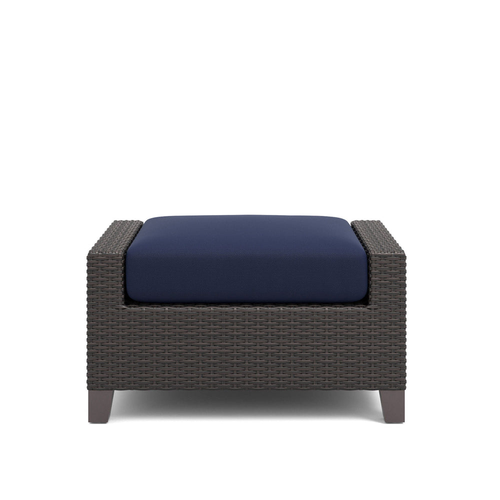 The Skye Outdoor Ottoman Set in rich Navy Blue includes 2 cushioned ottomans and is crafted with durable aluminum frames and a baked-on powder finish to ensure longevity and scratch resistance. The high-density HDPE wicker mimics the look of natural wicke