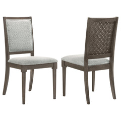 Elevate your dining space with this beautifully crafted dining chair, blending intricate detailing with luxurious comfort. The chair features a molded geometric design on the backrest, offering a striking visual appeal. Constructed from solid wood and emb