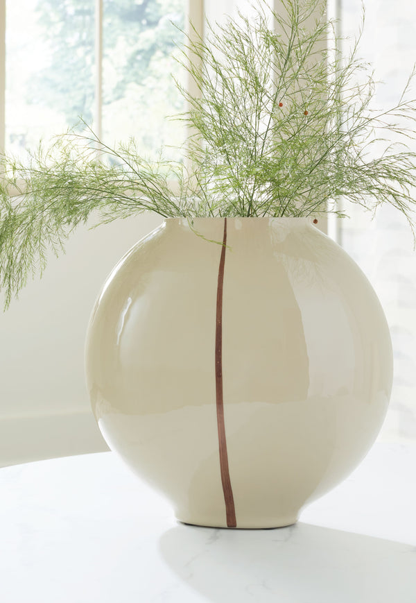  shelf or foyer with this vase. An eye-catching metallic accent showcases its softly rounded shape