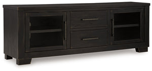 This TV stand brings a rustic vibe to urban contemporary design. Itâ€™s a modern approach to natural beauty, with the worn black finish giving your living room a gently aged charm. Console and media storage is made easy with cabinets and drawers. And the 