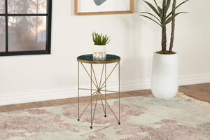  this round accent table adds a luxurious touch to any space. Featuring a solid green marble tabletop