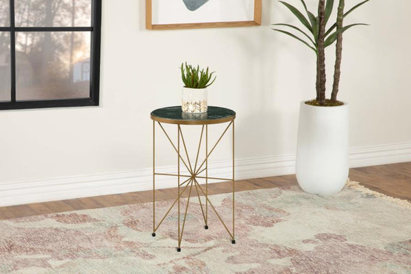  this round accent table adds a luxurious touch to any space. Featuring a solid green marble tabletop