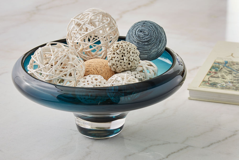 With an almost sculptural look, this bowl is a standout accent. Itâ€™s an effortlessly chic way to elevate your decor. Place it on a patio table to create an ultra-cool outdoor oasis. Or keep it on a coffee table to complete your contemporary living room.