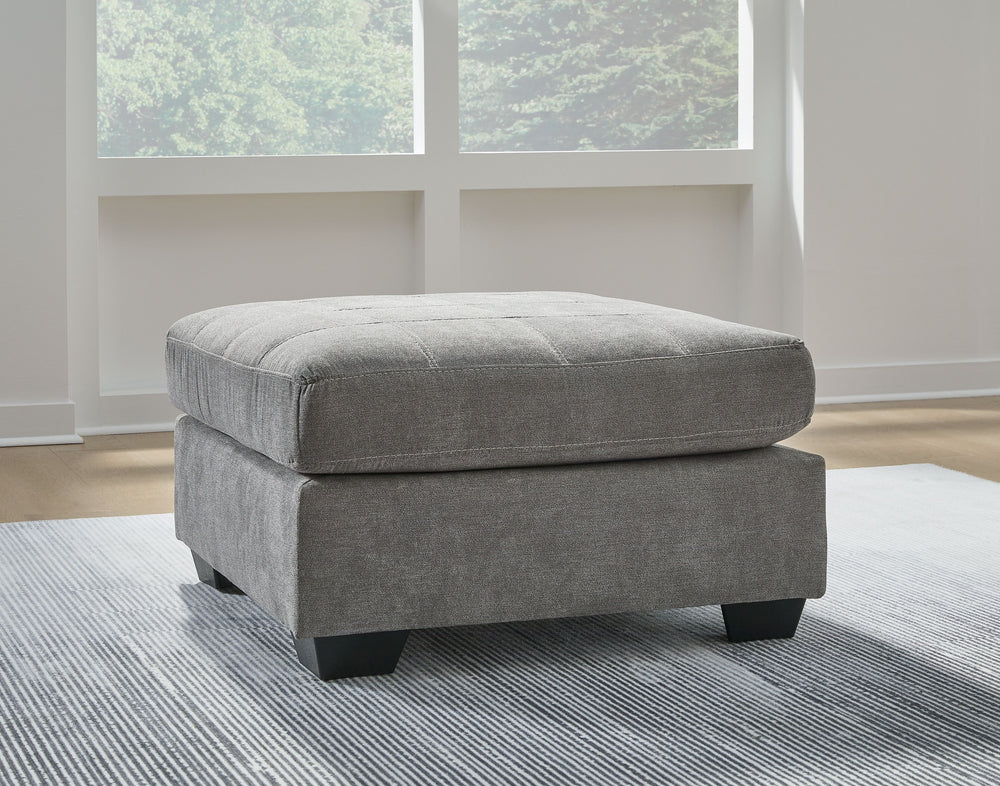 This oversized accent ottoman takes a homey approach to high style. Its gray coloration has classic versatility, while a contemporary silhouette and stitched details keep the look totally on trend. And you can count on comfortâ€”the ottoman-'s large scale
