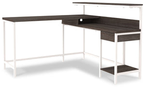  this home office L-desk is designed to raise your productivity by packing more work area into less space. Sporting a two-tone finish