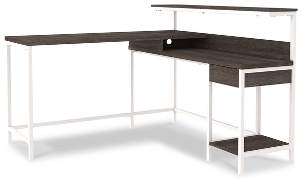  this home office L-desk is designed to raise your productivity by packing more work area into less space. Sporting a two-tone finish