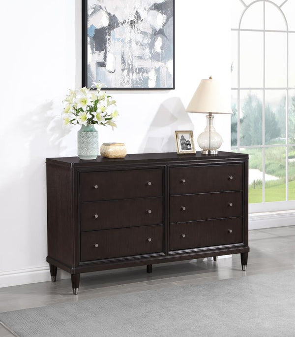  with metallic accents that add depth to tapering feel. Petite knobs decorate each drawer front as drawers offer ample storage
