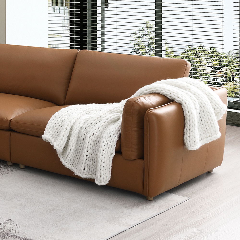 The Brighton sectional sofa exudes contemporary elegance and comfort. Covered in brown top grain leather, this spacious sectional is perfect for family gatherings or cozy evenings at home. Its sleek design and plush cushions offer both style and relaxatio