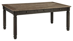 Invite your family into the heart of your home with this rectangular dining room table. Its tapered legs, in a beautifully textured black finish, provide a sturdy foundation. A timeworn planked oak top creates a unique two-tone contrast, while drawers off