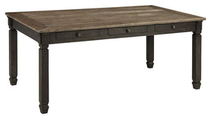 Invite your family into the heart of your home with this rectangular dining room table. Its tapered legs, in a beautifully textured black finish, provide a sturdy foundation. A timeworn planked oak top creates a unique two-tone contrast, while drawers off