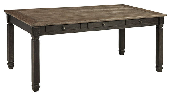 Invite your family into the heart of your home with this rectangular dining room table. Its tapered legs, in a beautifully textured black finish, provide a sturdy foundation. A timeworn planked oak top creates a unique two-tone contrast, while drawers off