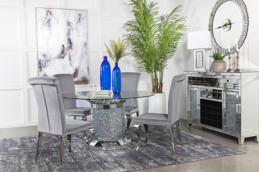 Invite over a few guests to celebrate at this modern glam dining table. A round, clear glass top reveals the scintillating column-inspired pedestal frame beneath, offering an open and airy look. Sparkling faux diamonds are encrusted within the base for a 