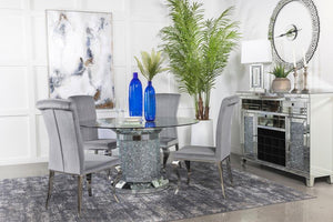  clear glass top reveals the scintillating column-inspired pedestal frame beneath