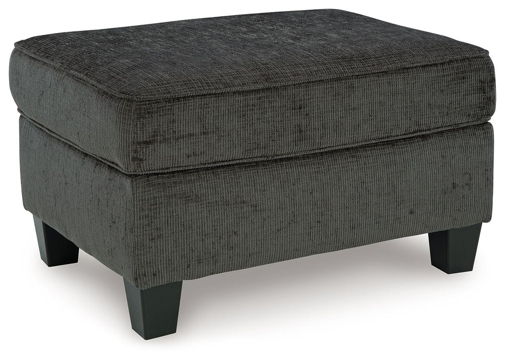 Thereâ€™s something about the Erinslane ottoman thatâ€™s so easy to appreciate. Maybe itâ€™s the plush upholstery and soothing tone, eager to support your quest for total relaxation. Perhaps it-'s the modern flair of its design, with simple lines and tape