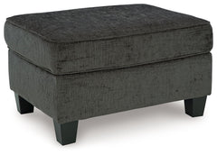 Thereâ€™s something about the Erinslane ottoman thatâ€™s so easy to appreciate. Maybe itâ€™s the plush upholstery and soothing tone, eager to support your quest for total relaxation. Perhaps it-'s the modern flair of its design, with simple lines and tape