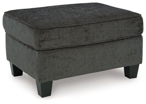 Thereâ€™s something about the Erinslane ottoman thatâ€™s so easy to appreciate. Maybe itâ€™s the plush upholstery and soothing tone, eager to support your quest for total relaxation. Perhaps it-'s the modern flair of its design, with simple lines and tape