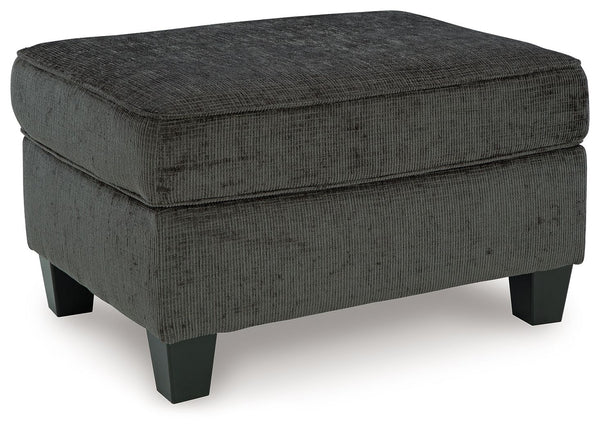 Thereâ€™s something about the Erinslane ottoman thatâ€™s so easy to appreciate. Maybe itâ€™s the plush upholstery and soothing tone, eager to support your quest for total relaxation. Perhaps it-'s the modern flair of its design, with simple lines and tape