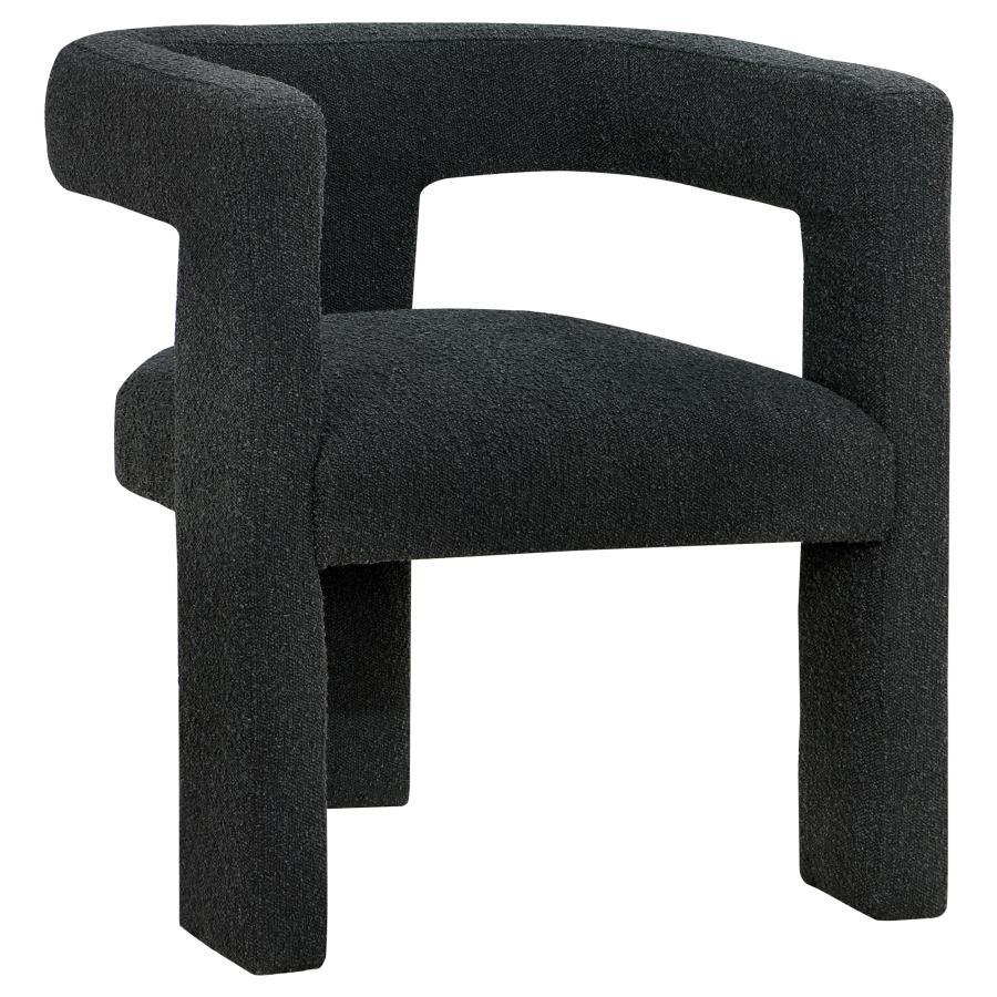 Enveloped entirely in the embrace of plush bouclÃ©, this chair redefines the art of relaxation with its all-fabric design. The seamless transition from the cushioned seat to the curved arms, all robed in the same soft fabric, creates a cocoon of comfort. 