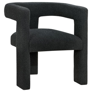 Enveloped entirely in the embrace of plush bouclÃ©, this chair redefines the art of relaxation with its all-fabric design. The seamless transition from the cushioned seat to the curved arms, all robed in the same soft fabric, creates a cocoon of comfort. 