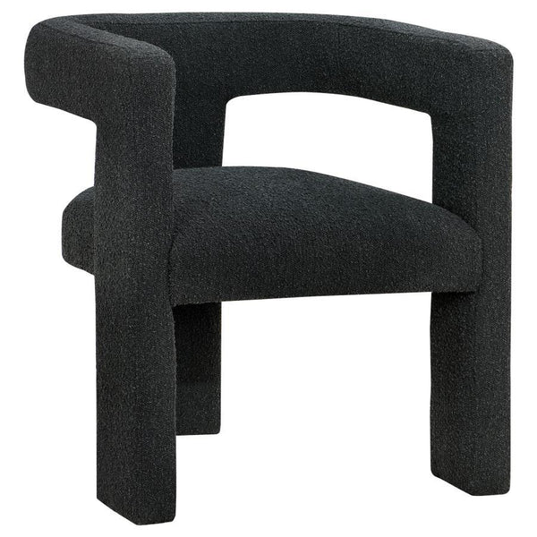 Enveloped entirely in the embrace of plush bouclÃ©, this chair redefines the art of relaxation with its all-fabric design. The seamless transition from the cushioned seat to the curved arms, all robed in the same soft fabric, creates a cocoon of comfort. 