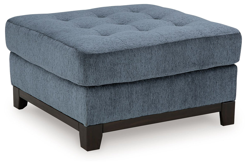 Fresh, on-trend style meets functionality in this oversized accent ottoman. Details like a tufted top cushion and wrap-around accent base reflect your urban contemporary tastes while staying versatile as your style changes. And with its soft upholstery, y