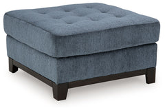 Fresh, on-trend style meets functionality in this oversized accent ottoman. Details like a tufted top cushion and wrap-around accent base reflect your urban contemporary tastes while staying versatile as your style changes. And with its soft upholstery, y