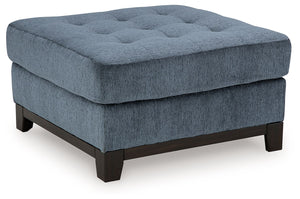 Fresh, on-trend style meets functionality in this oversized accent ottoman. Details like a tufted top cushion and wrap-around accent base reflect your urban contemporary tastes while staying versatile as your style changes. And with its soft upholstery, y