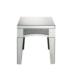 Brighten up your empty living room with the Nowles occasional table. This table offers a mirrored top and arched apron with faux stone inlay. The structure built from composite wood and mirrored panels covering every surface. A glam display table that nat