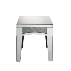 Brighten up your empty living room with the Nowles occasional table. This table offers a mirrored top and arched apron with faux stone inlay. The structure built from composite wood and mirrored panels covering every surface. A glam display table that nat