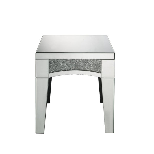 Brighten up your empty living room with the Nowles occasional table. This table offers a mirrored top and arched apron with faux stone inlay. The structure built from composite wood and mirrored panels covering every surface. A glam display table that nat