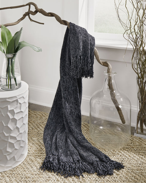  this black throw blanket also makes a stylish statement. Whether draped over the arm of a sofa or folded at the foot of a bed