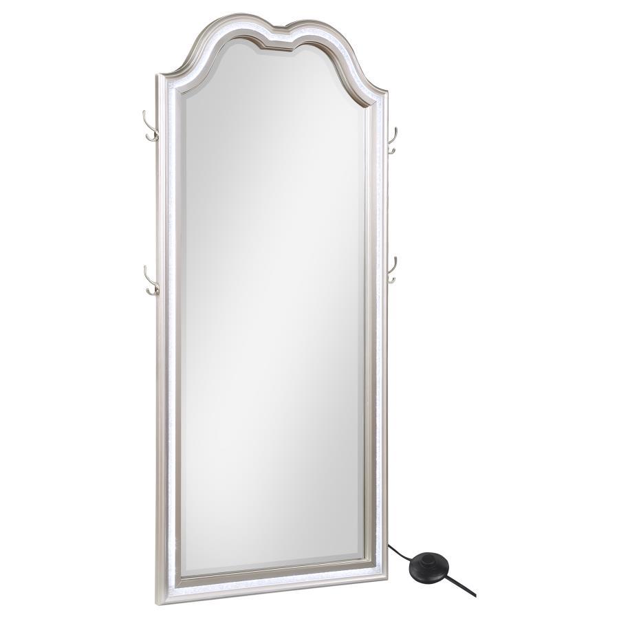 Chic couture style is a featured element of a lighted LED floor mirror well suited to fashionable living spaces. The Evangeline floor mirror offers a shapely silhouette with an arch top and rectangular profile. Its pine wood frame offers a silver oak fini
