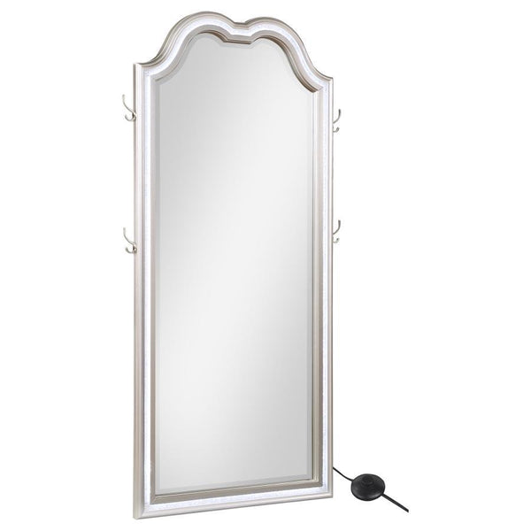 Chic couture style is a featured element of a lighted LED floor mirror well suited to fashionable living spaces. The Evangeline floor mirror offers a shapely silhouette with an arch top and rectangular profile. Its pine wood frame offers a silver oak fini
