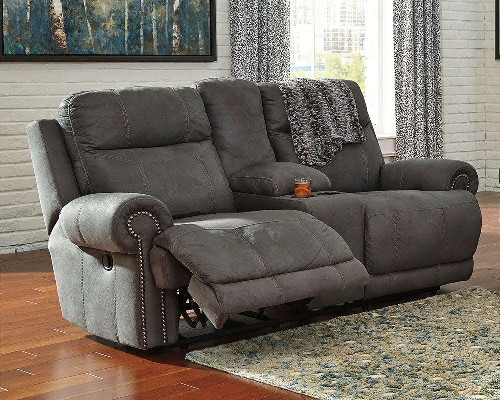 Sparing that -"puffy-" look you might expect from a recliner, this reclining loveseat with console doesn-'t hold back when it comes to contemporary style. Subtle touches such as sporty jumbo stitching, nailhead trim and a -"weather worn-" effect on the up