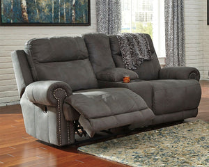  this reclining loveseat with console doesn-'t hold back when it comes to contemporary style. Subtle touches such as sporty jumbo stitching