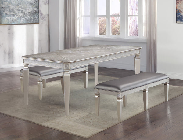 Make a bold statement in your dining space with this glamorous and sophisticated dining group, designed to bring luxury and elegance to every gathering. The sleek table features exquisite detailing along its edges, complemented by a shimmering finish that