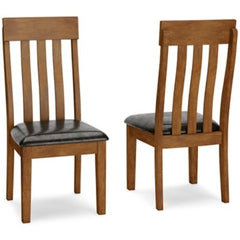 Comfortably contoured, with a rake back design, this dining room upholstered side chair beautifully captures the essence of rustic refinement. Plushly upholstered faux leather seat makes pulling up a chair so much more enticing. Makes for easy cleanup, to