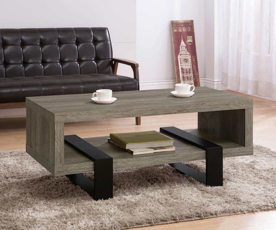 Experience a modern aesthetic with this rectangular coffee table that combines style and functionality. The grey driftwood finish highlights realistic wood grain, creating a rustic yet contemporary look. Crafted from durable engineered wood with a scratch