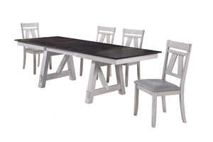 The Maisie 5 Piece Wood Dining Set combines quality construction with modern rustic style, making it a perfect addition to any dining space. This set includes a two-tone dining table with self-storing leaves and four dining chairs. Crafted from solid rubb