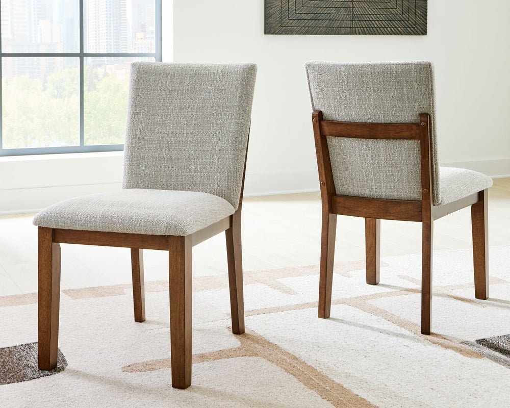 Experience worry-free living with this dining chair. Handle life-'s little messes with ease thanks to washable Next-Gen Nuvellaâ„¢ performance fabric. Designed to effortlessly blend casual and refined aesthetics, the rich brown butcher block veneer exudes