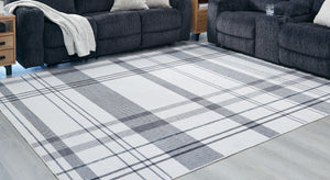  this accent rug is both classic and contemporary. Its plaid design