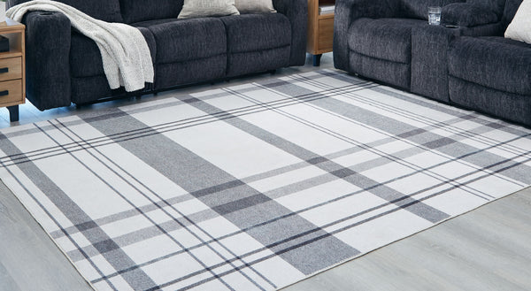  this accent rug is both classic and contemporary. Its plaid design